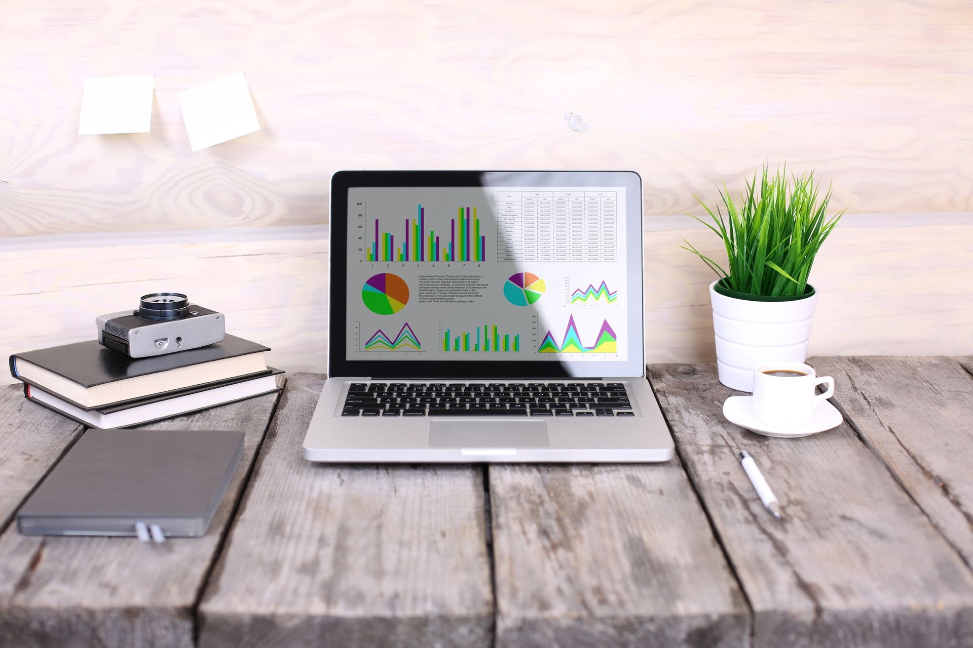 analyzing statistics on laptop screen, working with financial graphs charts online, using business software for data analysis 
and project management concept, rear close up view